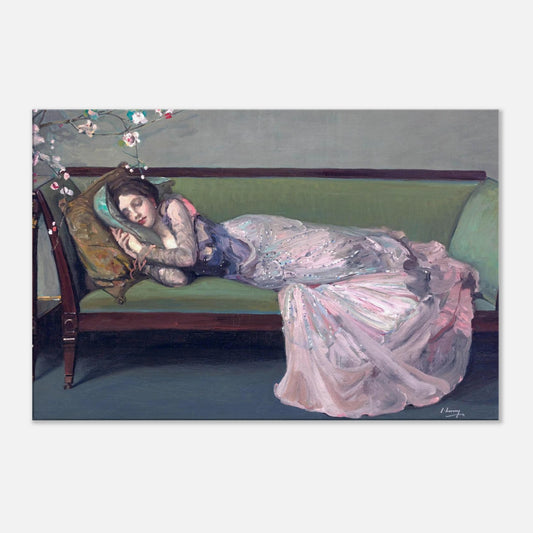 Woman in a long, light-colored dress lying on a green couch with a floral headpiece.
