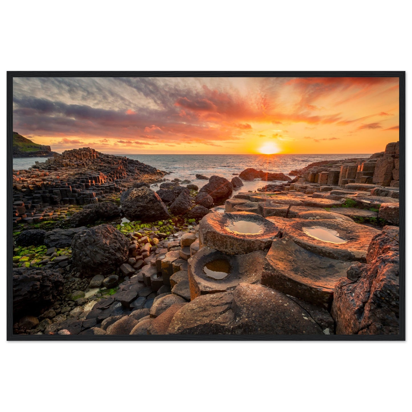 Capture the breathtaking beauty of nature with our framed art print featuring a mesmerising sunset at Giant's Causeway.