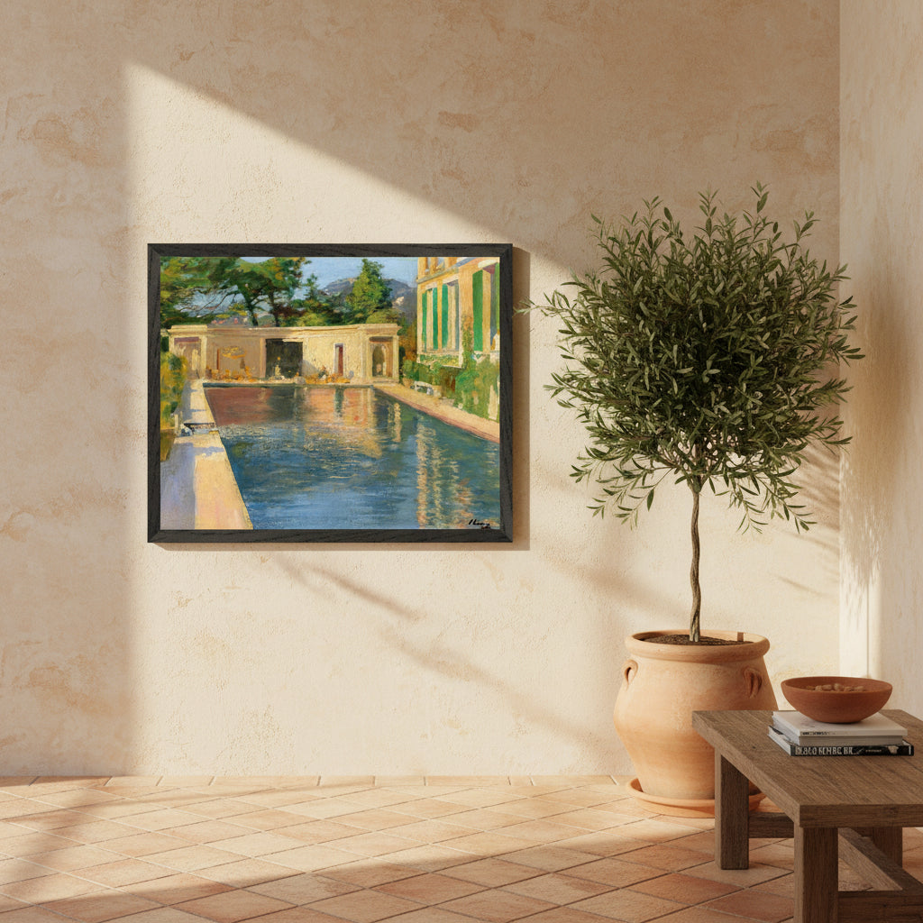 Collector’s Edition framed print of “Swimming Pool, Southern France” hanging in a sunlit Mediterranean-style interior with warm stucco walls, olive plants, soft coastal light, and a premium black hardwood frame.