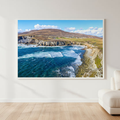 Large 60×90 cm Achill Island framed print on a white wall, oak floors, neutral furnishings and soft ambient lighting, ocean view artwork as the room’s focal point.